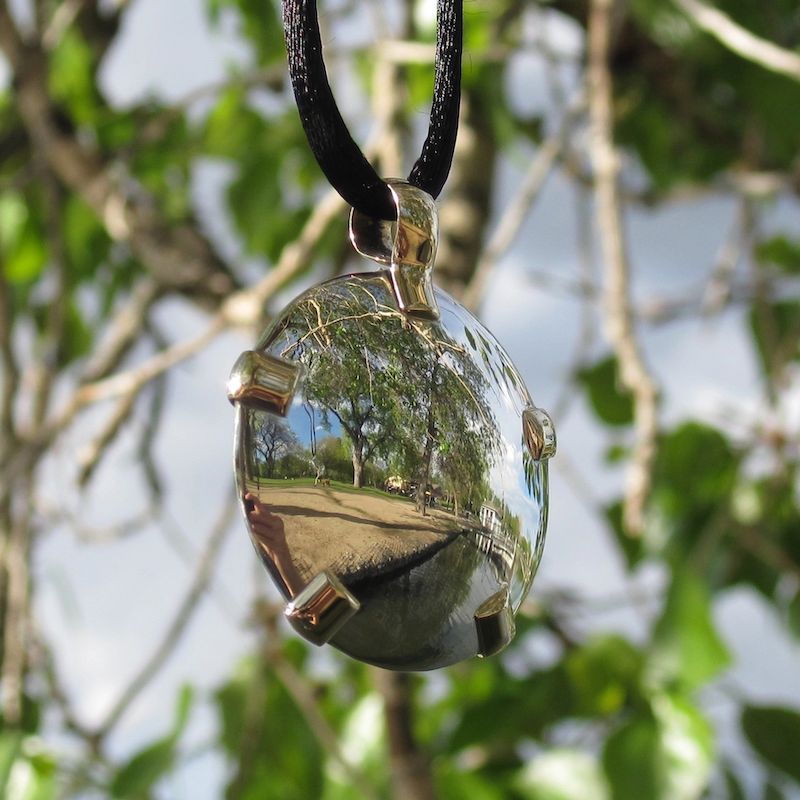 BioElectric Shield pendant charging in sunlight