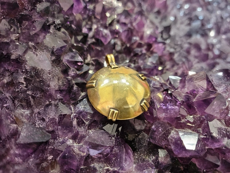 BioElectric Shield and grounding crystals (black tourmaline, smoky quartz, hematite) on natural background